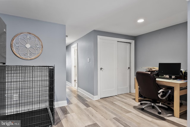 office area with light hardwood / wood-style flooring