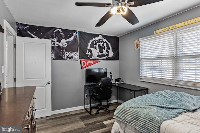 bedroom featuring dark hardwood / wood-style flooring and ceiling fan