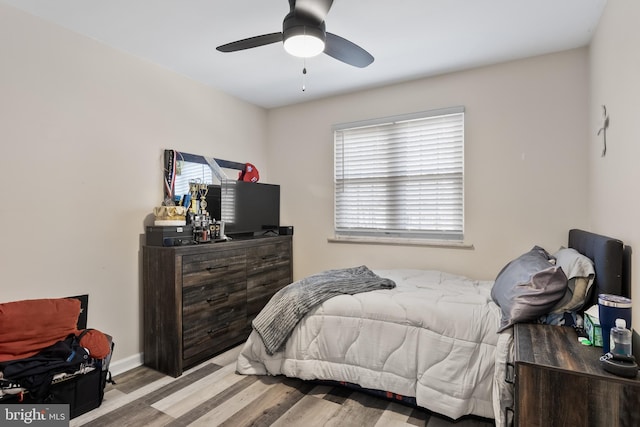 bedroom featuring light hardwood / wood-style floors and ceiling fan