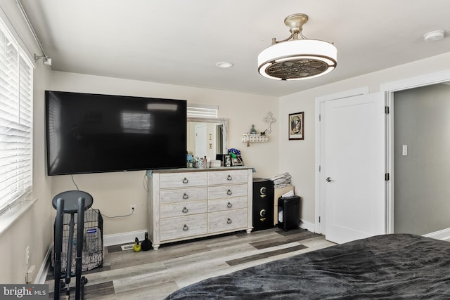 bedroom with hardwood / wood-style flooring