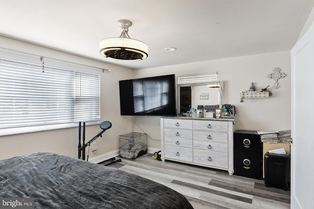 bedroom with light hardwood / wood-style flooring