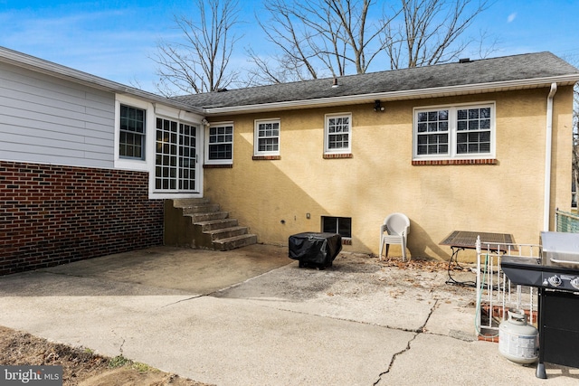 back of house with a patio area