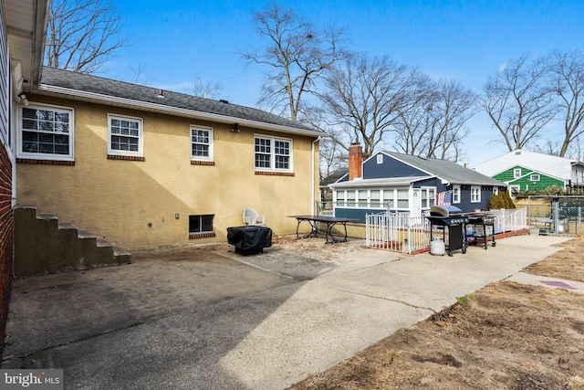 back of house with a patio