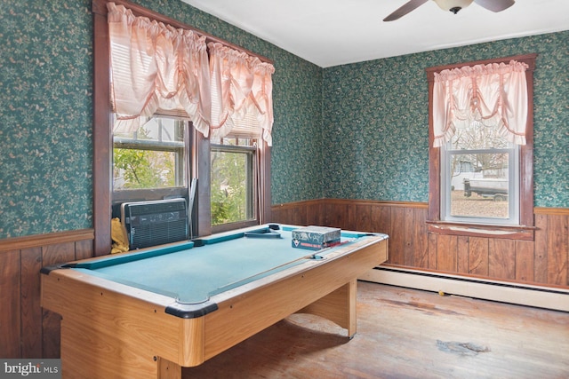 recreation room featuring billiards, wood-type flooring, baseboard heating, cooling unit, and ceiling fan