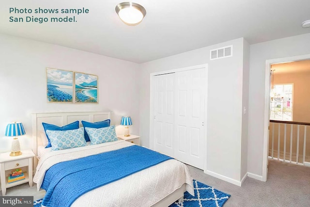 carpeted bedroom featuring a closet, visible vents, and baseboards