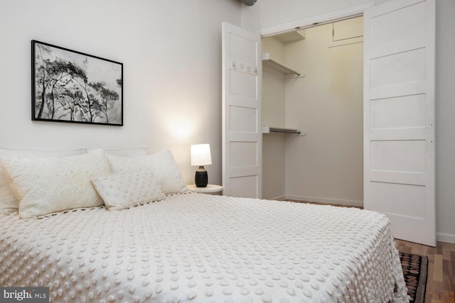 bedroom with hardwood / wood-style floors