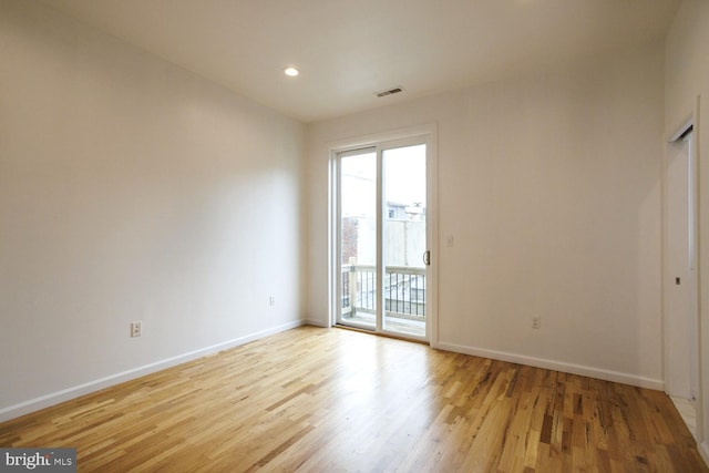 spare room featuring light wood-type flooring