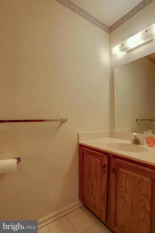 bathroom with tile patterned flooring and vanity