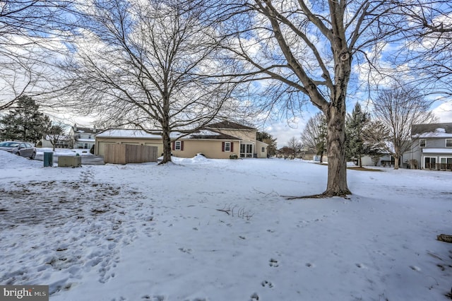 view of yard layered in snow