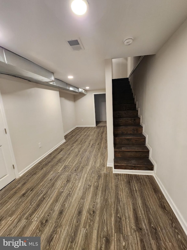 basement featuring dark wood-type flooring