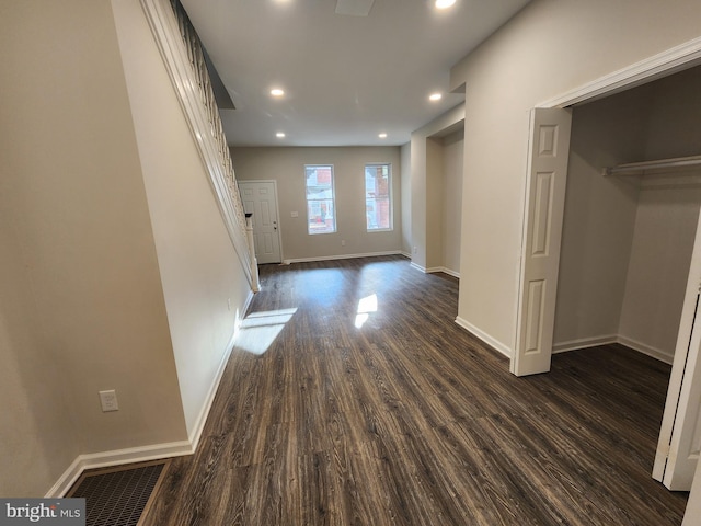 interior space with dark hardwood / wood-style flooring