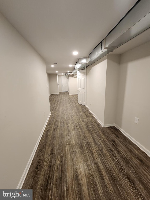 basement with dark wood-type flooring