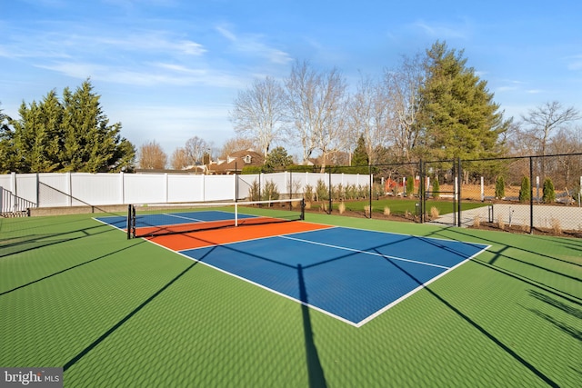 view of sport court featuring basketball hoop