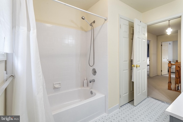 bathroom with shower / bathtub combination with curtain