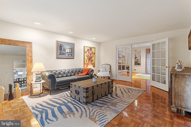 living room featuring dark parquet floors and french doors