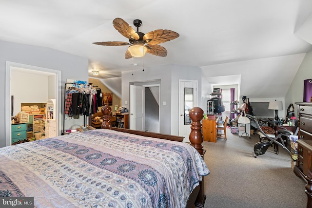 carpeted bedroom featuring ceiling fan and vaulted ceiling