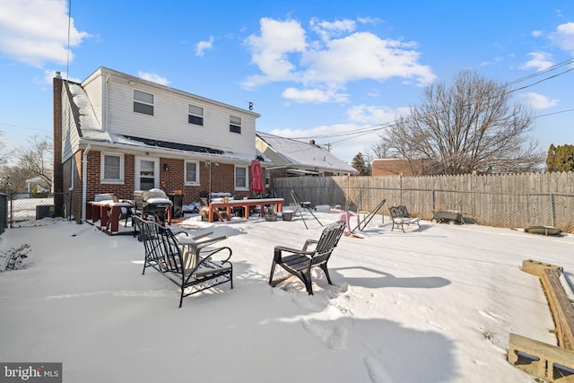 view of snow covered house