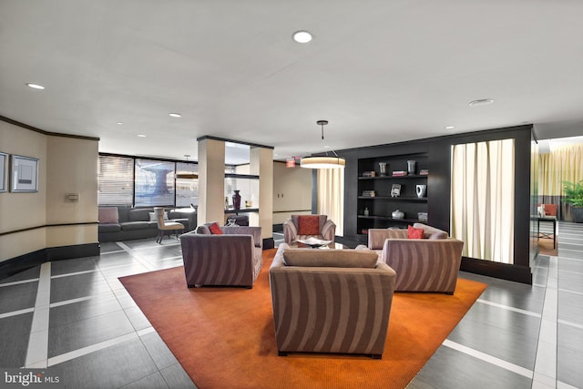 living room featuring ornamental molding, tile patterned floors, a wall of windows, and built in shelves