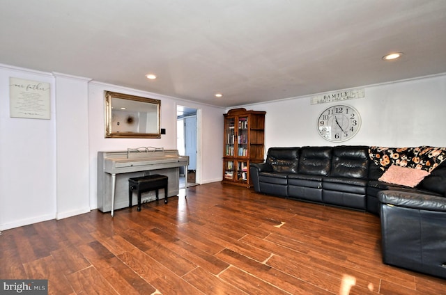 living room with crown molding and dark hardwood / wood-style floors