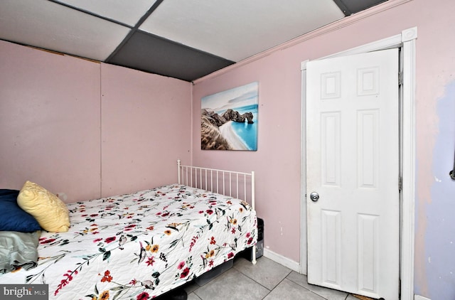 bedroom with light tile patterned floors