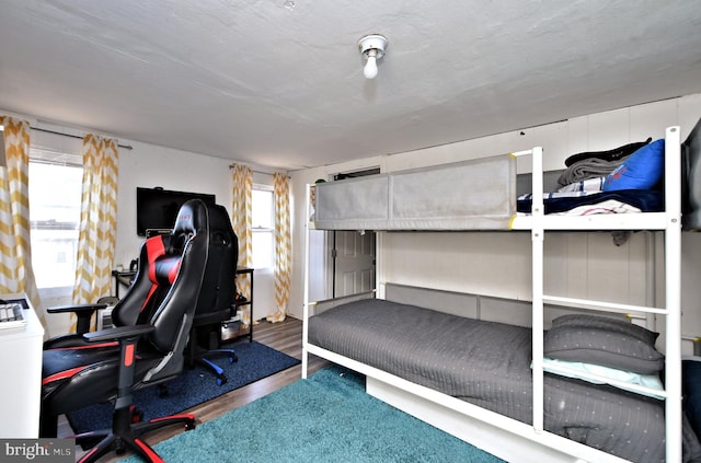 bedroom with wood-type flooring