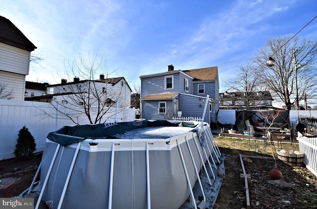 exterior space featuring a covered pool