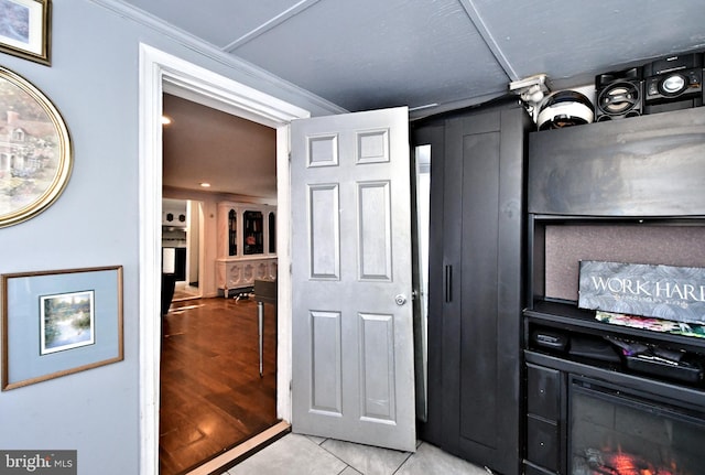 interior space featuring a fireplace and light tile patterned floors