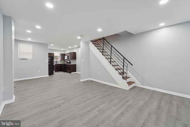 unfurnished living room with light hardwood / wood-style flooring