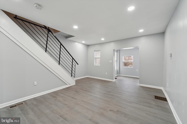 unfurnished living room featuring light hardwood / wood-style flooring