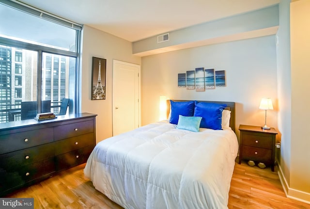 bedroom with light hardwood / wood-style flooring