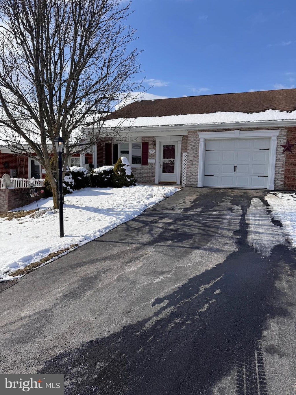 single story home with a garage