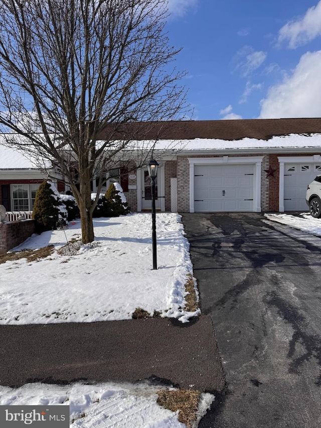 ranch-style house featuring a garage