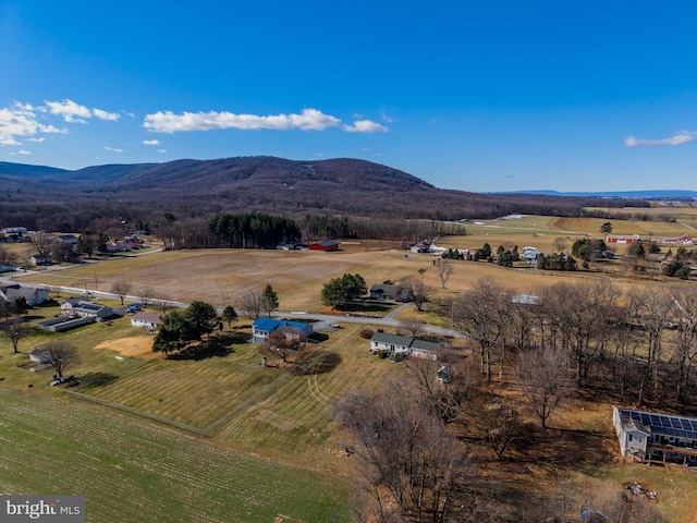 drone / aerial view with a mountain view and a rural view