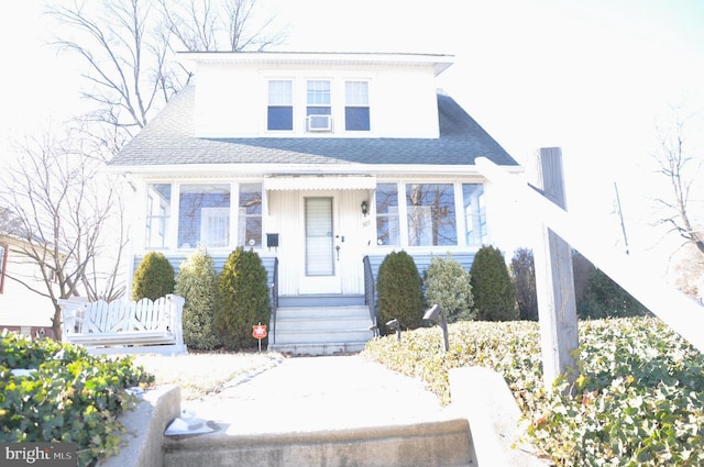 bungalow-style home featuring cooling unit