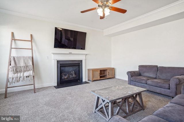 carpeted living room with crown molding and ceiling fan