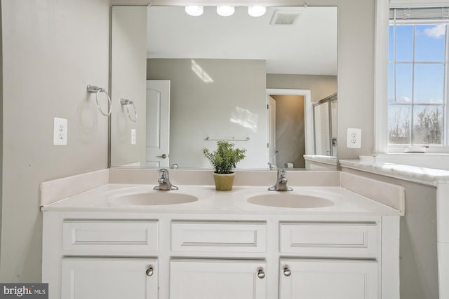 bathroom with vanity and walk in shower