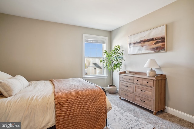 bedroom with light colored carpet