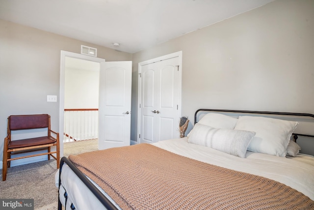 carpeted bedroom with a closet