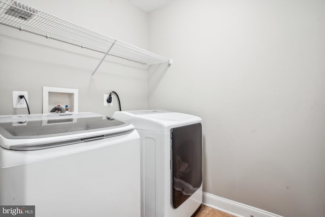 washroom featuring independent washer and dryer