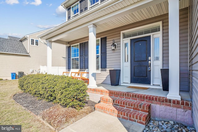 property entrance with cooling unit and covered porch