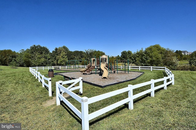 view of jungle gym with a lawn