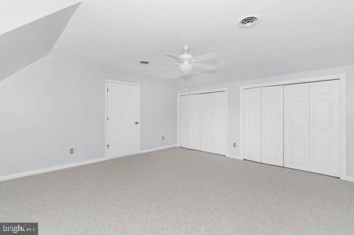 bonus room with ceiling fan, lofted ceiling, and carpet flooring