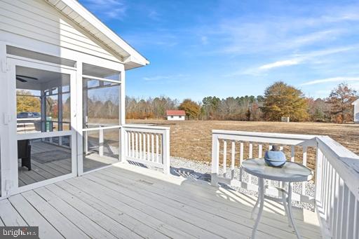 wooden terrace featuring a sunroom