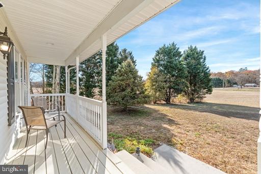 wooden deck featuring covered porch