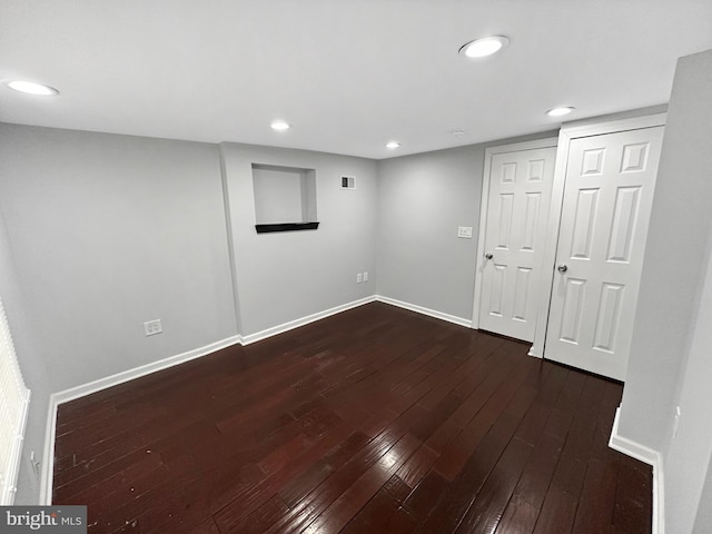 basement featuring dark wood-type flooring