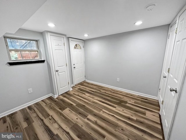 basement with dark wood-type flooring