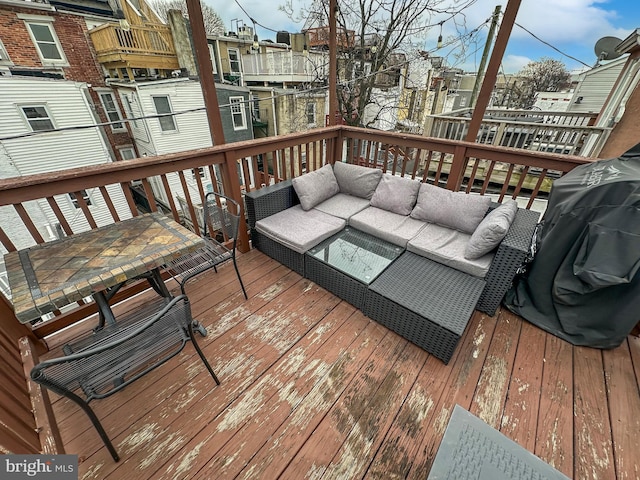 wooden deck with an outdoor hangout area