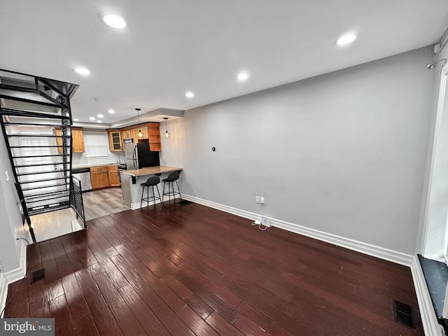 living room with dark hardwood / wood-style floors