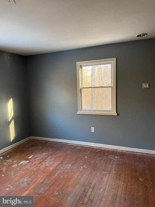 empty room featuring hardwood / wood-style flooring