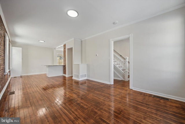 unfurnished living room with dark wood-type flooring and ornamental molding